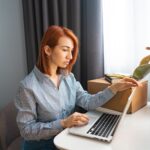 Woman working on computer in her office 